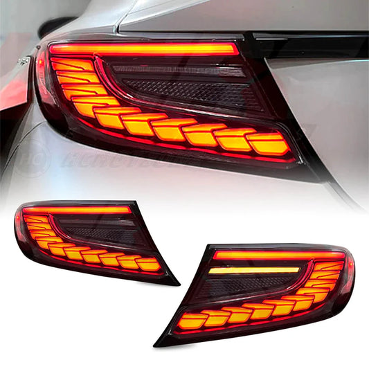Red Lens Full LED Dragon Scale Taillights for 2021-2024 Toyota GR86 and Subaru BRZ, featuring a unique dragon scale design with bright red brake lights, dynamic amber sequential turn signals, and full LED DRLs for enhanced visibility and a modern, stylish appearance