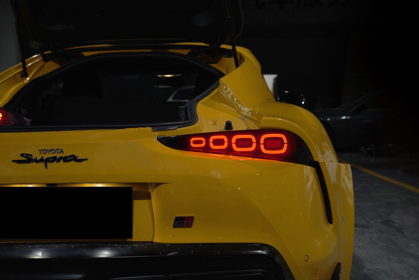 Smoked LED Aftermarket Taillight for 2018-2023 Toyota Supra featuring dynamic animation DRL, sequential turn signals, and red breathing light, designed for a modern aesthetic and enhanced road safety