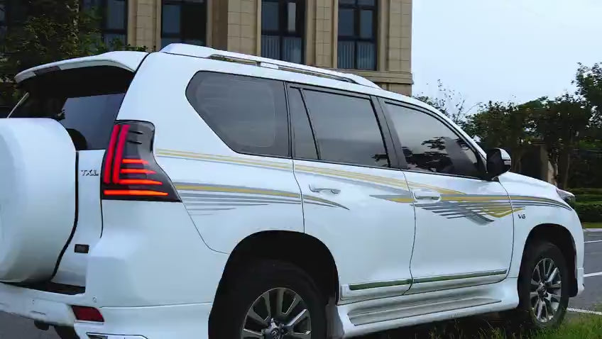 Smoked LED Taillights for 2010-2021 Toyota Prado, featuring sleek design with dynamic startup animation, bright red brake lights, amber sequential turn signals, and double white reverse lights, enhancing both the vehicle's modern aesthetic and safety.