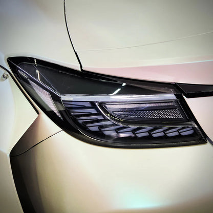 clear Lens Full LED Dragon Scale Taillights for 2021-2024 Toyota GR86 and Subaru BRZ, featuring a unique dragon scale design with bright red brake lights, dynamic amber sequential turn signals, and full LED DRLs for enhanced visibility and a modern, stylish appearance.